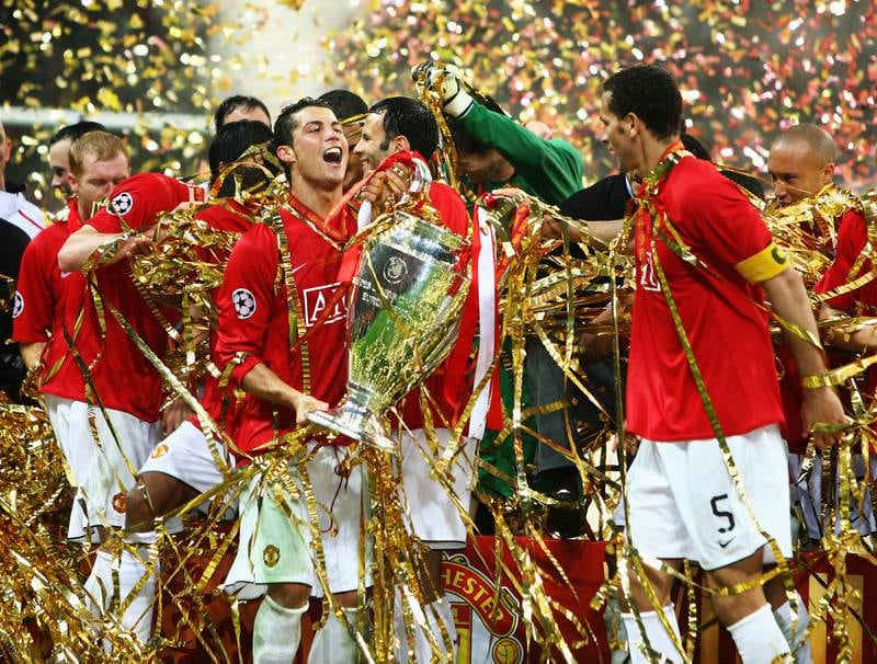 Cristiano Ronaldo and his Manchester United teammates celebrate with the Champions League trophy after defeating Chelsea in the final in 2008 in Moscow. They won in a penalty shootout after a 1-1 draw. Ronaldo made his way back to Old Trafford after leaving Juventus. Getty Images