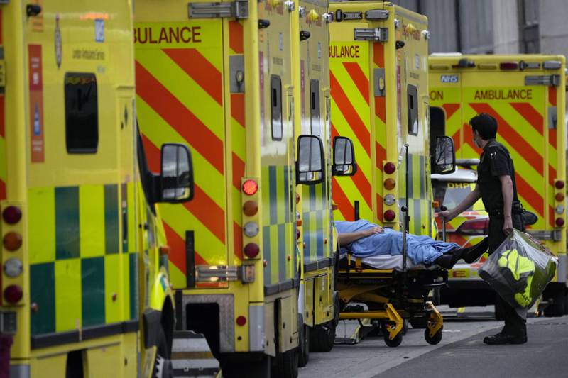 File photo: A patient is pushed on a trolley after arriving in an ambulance outside the Royal London Hospital in the Whitechapel area of east London, January 6, 2022. AP
