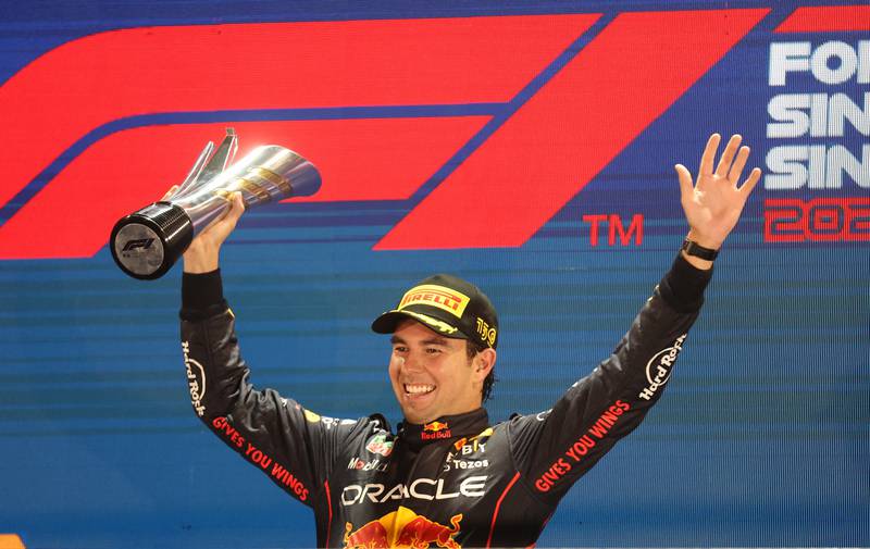 Red Bull's Sergio Perez celebrates after winning the Singapore Grand Prix on October 2, 2022. Reuters