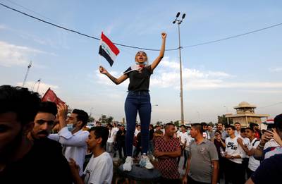 A woman demonstrator chants slogans during a protest over corruption, lack of jobs, and poor services, in Baghdad, Iraq. Reuters