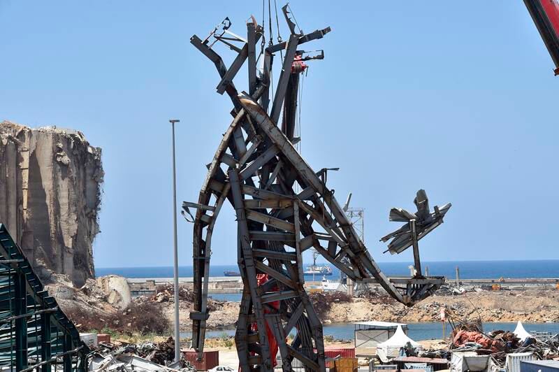 Workers install a monument inside Beirut port as a remembrance for the victims of the August 4 port blast in Beirut, Lebanon, July 27, 2021.  EPA