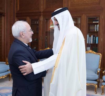 Emir of Qatar Sheikh Tamim bin Hamad al-Thani shakes hands with Iran's Foreign Minister Mohammad Javad Zarif during their meeting in Doha, Qatar October 3, 2017. Qatar News Agency/Handout via REUTERS     ATTENTION EDITORS - THIS PICTURE WAS PROVIDED BY A THIRD PARTY. NO RESALES. NO ARCHIVE.