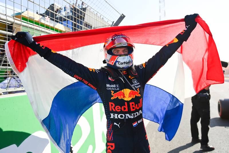 Max Verstappen holds up the Dutch flag after his win. Getty