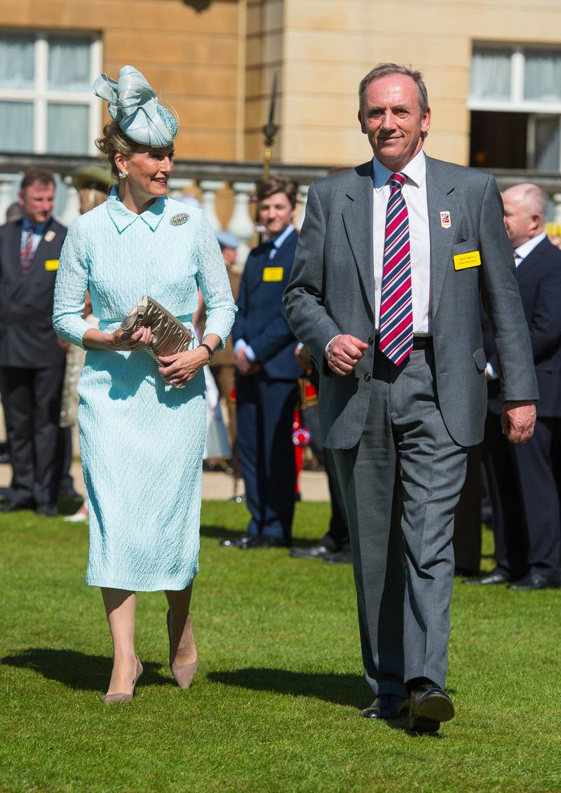 LONDON, ENGLAND - JUNE 04:  Sophie, Countess of Wessex, and Chief Executive of Blind Veterans UK Nick Caplin attend a garden party to meet Blind veterans and guests at Buckingham Palace on June 4, 2015 in London, England. The party, hosted by the Countess, was held to mark the 100th anniversary of Blind Veterans UK.  (Photo by Dominic Lipinski - WPA Pool/Getty Images)