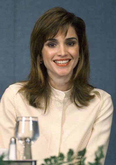 387758 01: Her Majesty Queen Rania of Jordan listens to her husband , Jordan's King Abdullah speak at the National Press Club, April 11, 2001 in Washington DC. (Photo by Mark Wilson/Newsmakers)