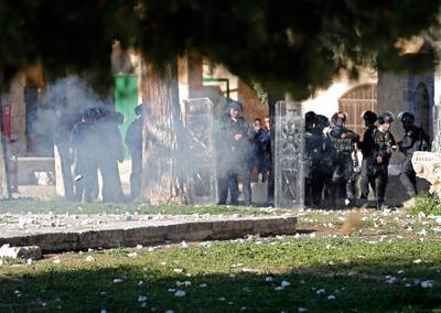 Israeli police fire tear gas towards Palestinian demonstrators. AFP