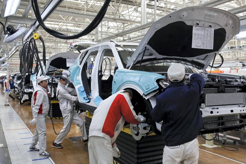 In this Sunday, Feb. 19, 2017 photo, workers assemble Haval SUV H7 models at the Great Wall Motors assembly plant in Baoding in north China's Hebei province. Great Wall Motors became China‚Äôs most profitable automaker by making almost nothing but low-priced SUVs. Now it wants to expand into global markets. (AP Photo/Andy Wong)