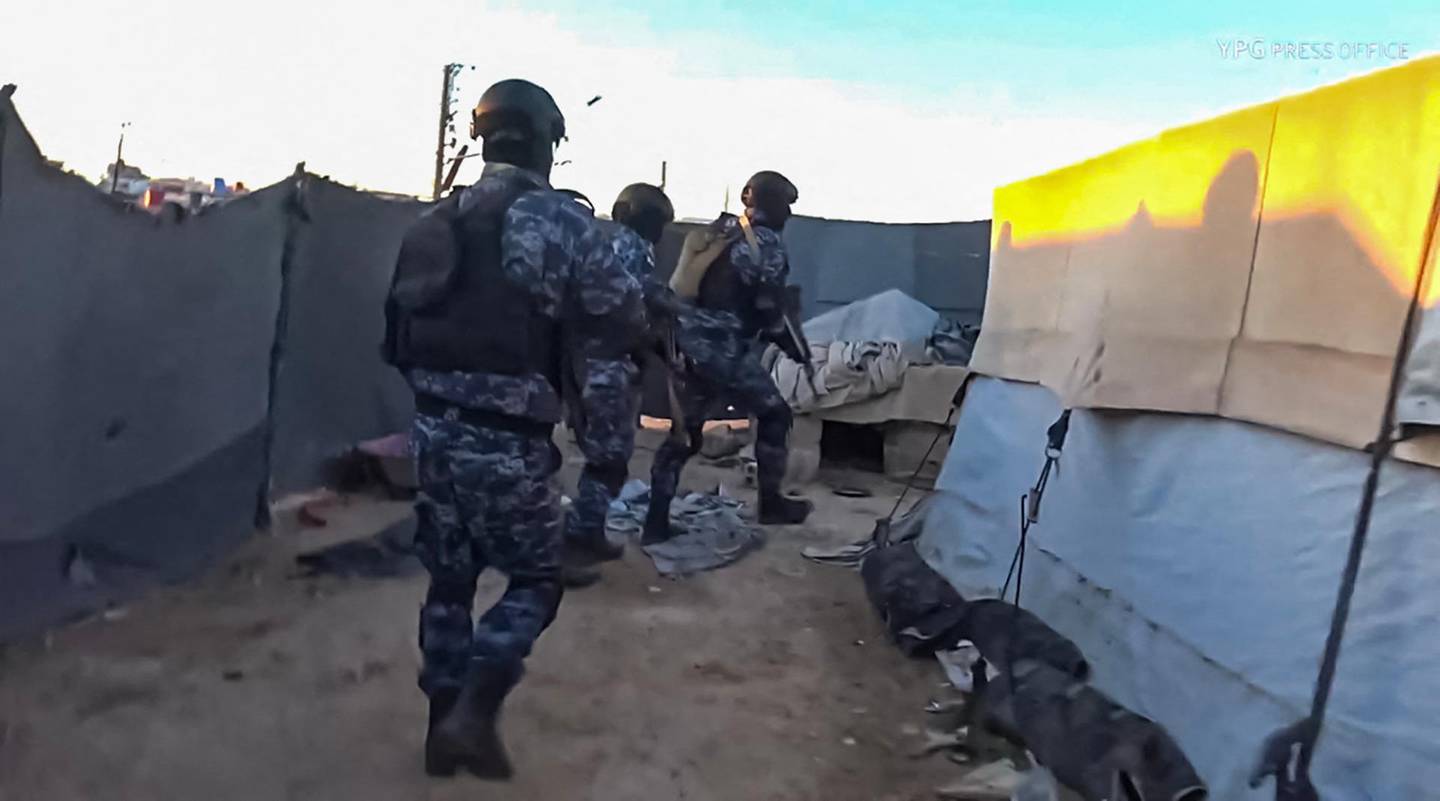 An image grab from a video made available on the People's Protection Units' (YPG) Press office on March 28, 2021, shows Kurdish YPG forces conducting a security operation at the Kurdish-run Al-Hol camp which holds suspected relatives of Islamic State (IS) group fighters, in the northeastern Syrian Hasakeh governorate. Kurdish forces made dozens of arrests in a security operation launched at the camp for suspected family members of Islamic State group militants in northeast Syria, a war monitor and Kurdish officials said. Al-Hol is the largest such settlement controlled by Kurdish authorities, who warn it is emerging as an extremist powder keg following dozens of murders in the camp since the start of the year. - RESTRICTED TO EDITORIAL USE - MANDATORY CREDIT "AFP PHOTO / YPG PRESS OFFICE" - NO MARKETING NO ADVERTISING CAMPAIGNS - DISTRIBUTED AS A SERVICE TO CLIENTS -
 / AFP / YPG Press Office / - / RESTRICTED TO EDITORIAL USE - MANDATORY CREDIT "AFP PHOTO / YPG PRESS OFFICE" - NO MARKETING NO ADVERTISING CAMPAIGNS - DISTRIBUTED AS A SERVICE TO CLIENTS -
