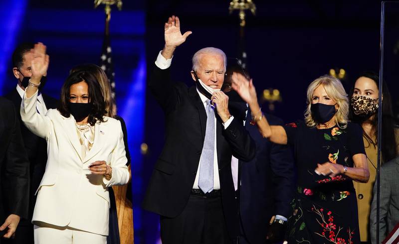 US president-elect Joe Biden and Jill Biden with vice president-elect Kamala Harris are joined by family members after Mr Biden delivered his victory address following the announcement of the winner in the 2020 presidential election, in Wilmington, Delaware. EPA
