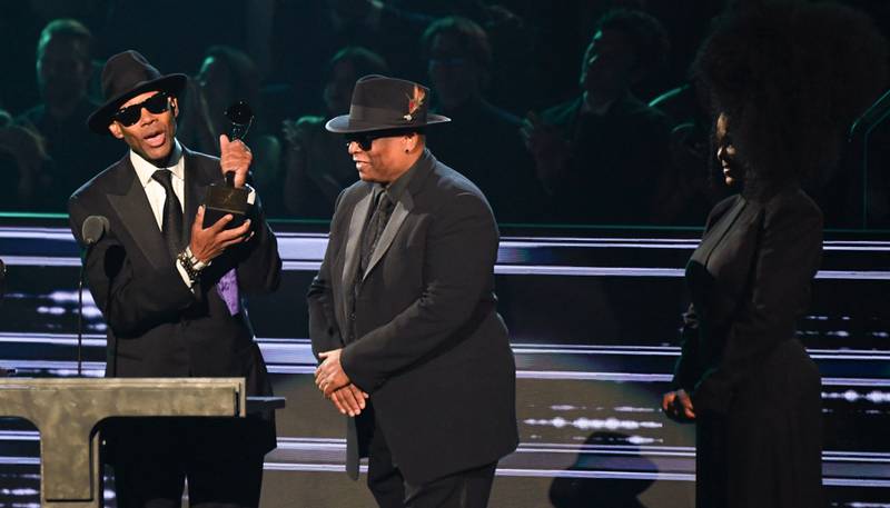 Musical Excellence Award recipients Jimmy Jam and Terry Lewis recieve their trophy from US singer-songwriter Janet Jackson. AFP