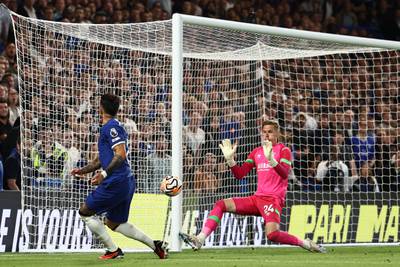 Luton Town goalkeeper Thomas Kaminski saves from Chelsea's Enzo Fernandez. AFP