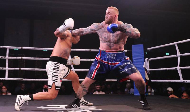 Hafthor Bjornsson, right, of Iceland in action against former Commonwealth Games gold medallist Simon Vallily of England during an exhibition boxing match at the Conrad Dubai Hotel, Dubai. EPA
