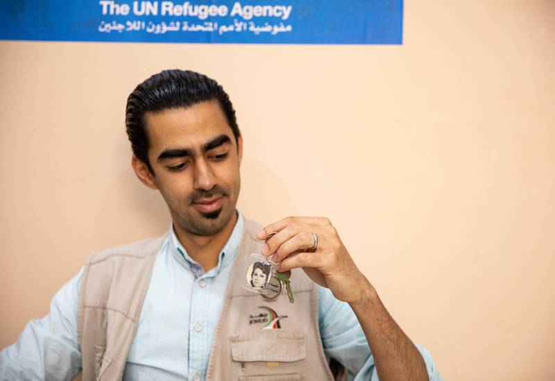 Twenty nine years old Syrian refugee Nacir looks at his Damascus home key and its chain with a photo of his mother as he talks about what  he misses, at the UNHCR (UN Refugee Agency) and Johud (Jordanian Hashemite Fund for Humanitarian Development) run, Nuzha Community Support Center for refugees in Amman, Jordan.  Nacir is originally from Damascus, Syria, he left in 2012 to flee raising violence for what he thought was a temporary time but has not returned since then. In Syria he was in a tourism hospitality school and was proudly ranked second in the whole country securing a job with a famous hotel chain in Damascus. Upon moving to Jordan he did all kinds of odd jobs and started volunteering to help other refugees adapt to their new lives, get training, rejoin school and started a training as baker. He is now an important member at the Nuzha Community Support Center for refugees, and works every day as a baker in a popular store bakery. He brought with him from Syria his collection of suit cuffs as he was only wearing suits before, a key to his family home with his mother's photo, Syrian money, his passport and the tie from his tourism and hospitably school uniform. World Refugee Day is marked annually on 20 June. According to the UNHCR, more and more refugees today live in urban settings outside refugee camps. EPA