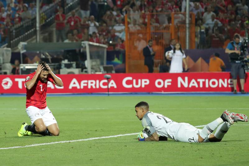 Egypt's Mahmoud Hassan, left, reacts after a missed scoring opportunity saved by South Africa goalkeeper Ronwen Williams during the Africa Cup of Nations Round of 16 match. AP Photo