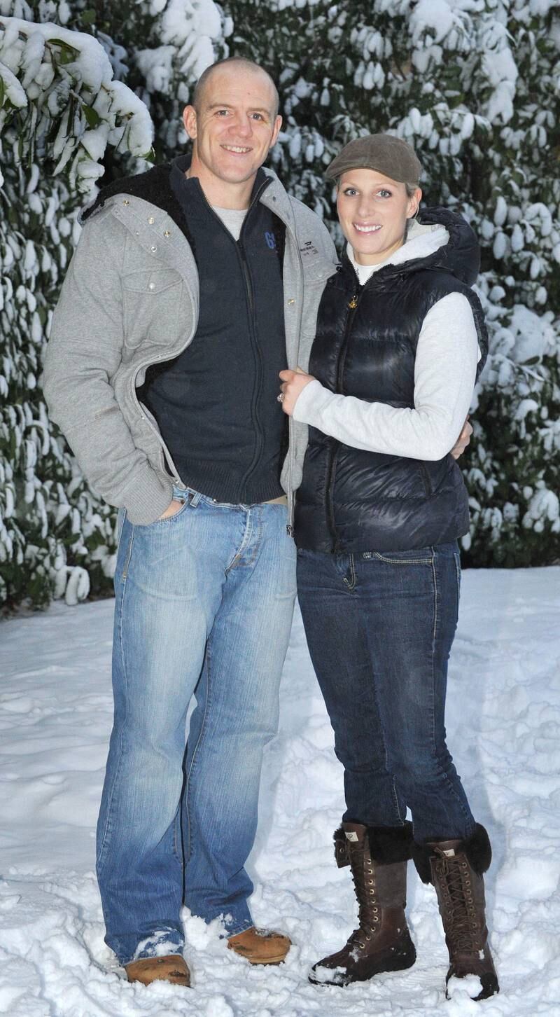 Zara Phillips, wearing a grey hoodie, navy gilet, jeans and leather Ugg boots, and Mike Tindall pose outside their home after announcing their engagement on December 21, 2010. Getty Images 