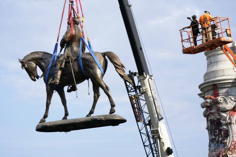 Last month, crews removed one of the country's largest remaining monuments to the Confederacy, a towering statue of Confederate General Robert E. Lee in Richmond, Virginia. AP 