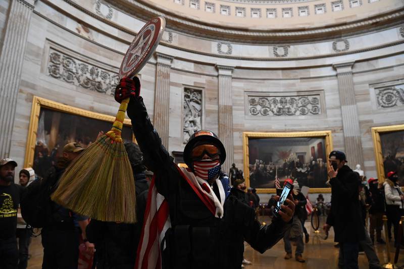 Supporters of US President Donald Trump enter the US Capitol's Rotunda. AFP