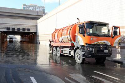 Municipal workers attempt to clear a flooded tunnel in Sharjah on Sunday morning. Courtesy: Sharjah Municipality