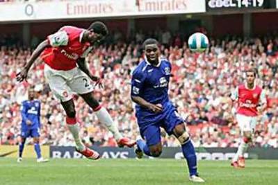 Emmanuel Adebayor in action for Arsenal. His dream move to AC Milan may depend on Ronaldinho's next club.