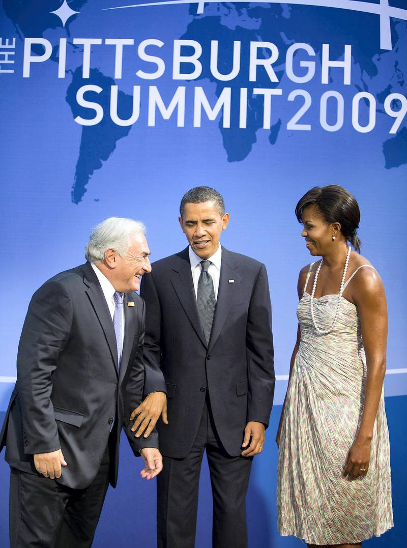 US President Barack Obama (C) and First Lady Michelle Obama greet International Monetary FundÕs Managing Director Dominique Strauss-Kahn (L) for the G-20 official dinner Septmber 24, 2009 at the Phipps Conservatory in Pittsburgh, Pennsylvania. International Monetary Fund Photograph/Stephen Jaffe