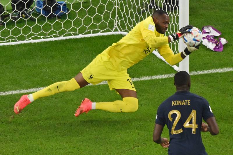 France's goalkeeper Steve Mandanda makes a save. AFP