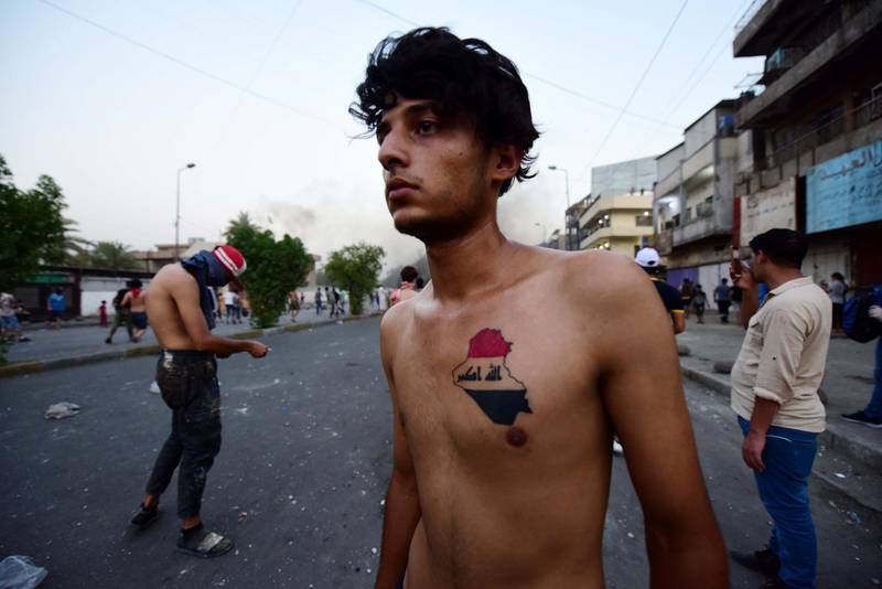 Demonstrators take part in a protest at the Al Tayaran square in central Baghdad, Iraq.  EPA