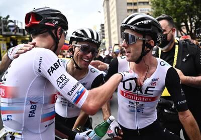 Adam Yates celebrates with teammates after winning Stage 1 of the Tour de France. Reuters