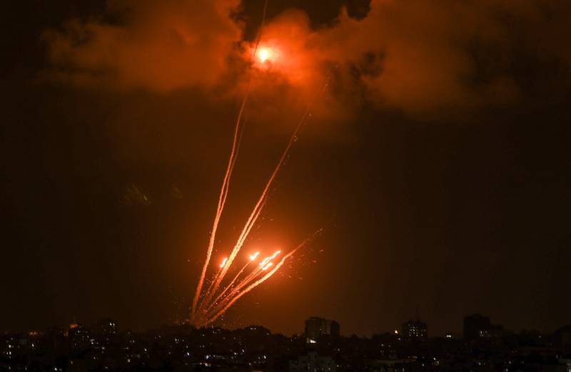A salvo of rockets is fired from Gaza City towards Israel.  AFP