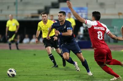 Cristiano Ronaldo of Al Nassr takes on Morteza Pouraliganji of Persepolis in the Saudi side's 2-0 AFC Champions League Group E victory at Azadi Stadium in Tehran on September 19, 2023. EPA