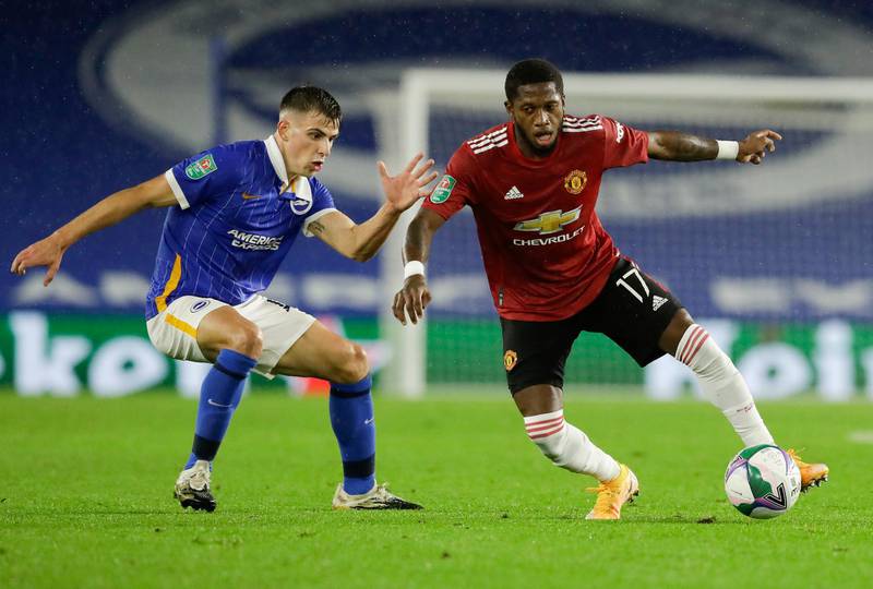 Manchester United's Fred, right, and Brighton's Jayson Molumby compete for the ball during the English League Cup fourth round soccer match between Brighton and Manchester United at Falmer Stadium in Brighton, England, Wednesday, Sept. 30, 2020. (Matt Dunham/Pool via AP)