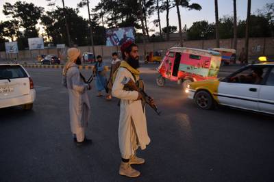 Taliban fighters police a road in Herat. AFP