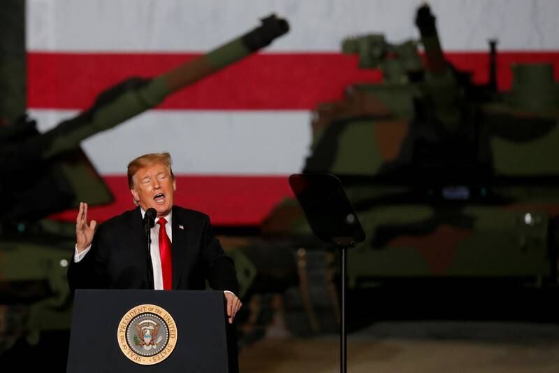 U.S. President Donald Trump speaks to workers in front of U.S. Army tanks on display at the Lima Army Tank Plant (LATP) Joint Systems Manufacturing Center, the country's only remaining tank manufacturing plant, in Lima, Ohio, U.S., March 20, 2019. REUTERS/Carlos Barria