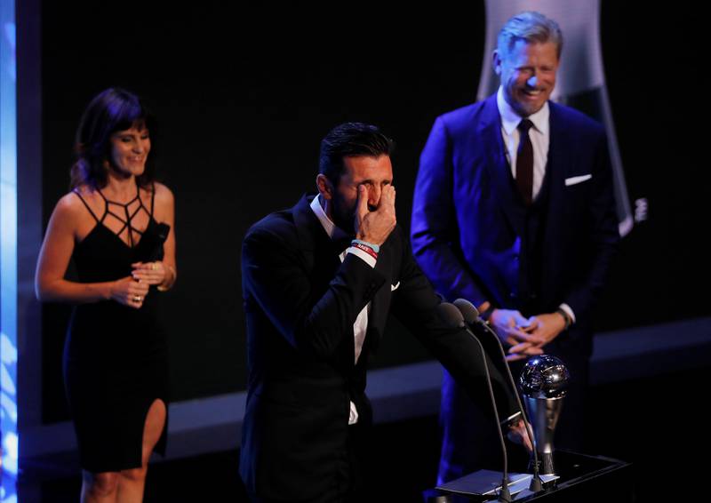 Juventus’ Gianluigi Buffon reacts as he is presented with The Best Fifa Goalkeeper Award by former Manchester United player Peter Schmeichel during the awards ceremony at the London Palladium. Eddie Keogh / Reuters