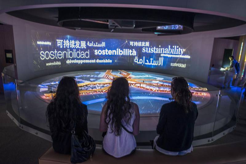 Visitor watch a virtual presentation at the UAE pavilion. Giuseppe Aresu / The National