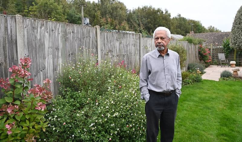 Abdulrazak Gurnah poses for pictures at his home in Canterbury, England, after winning the Nobel Prize in Literature. EPA