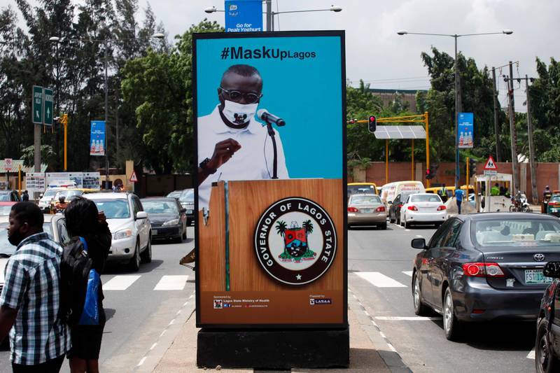 epa08543992 A billboard campaigning for the prevention of the coronavirus is seen standing in a neigbourhood in Lagos, Nigeria, 13 July 2020. While governments at various levels and other institutional agencies have invested several billions of Nigeria's currency on advertorial campaigns on the prevention of the spread of the coronavirus, there are doubts among the general populace as to whether coronavirus is real, citing it as a politicized avenue through which politicians siphon money from the state coffers and, squandering donations from the international donors.  EPA/AKINTUNDE AKINLEYE
