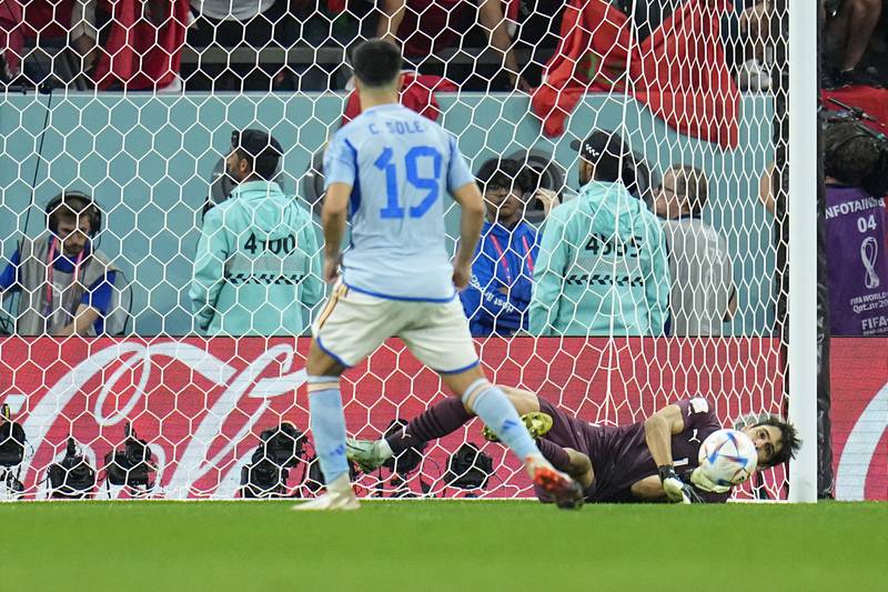 Morocco goalkeeper Yassine Bounou saves from Spain's Carlos Soler during the shoot-out. AP