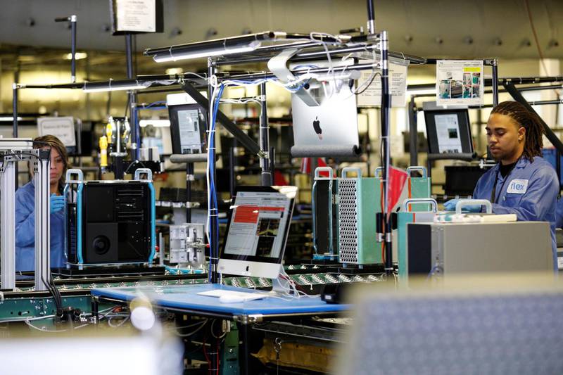 Flextronics International Apple factory employees work on Apple Mac Pro computer assembly. Reuters