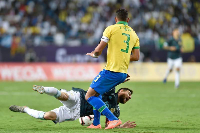 Messi is fouled by Brazil's Thiago Silva during the match between Brazil and Argentina at King Fahd stadium in Riyadh, Saudi Arabia. AP