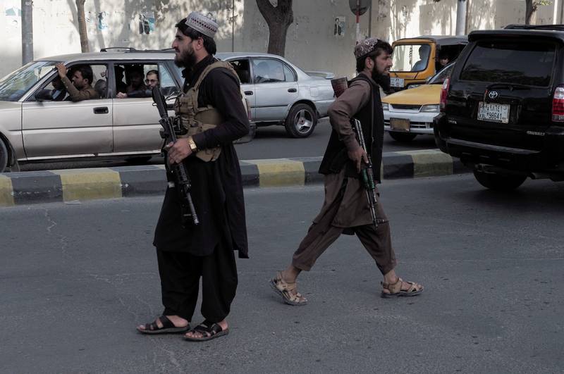 Taliban fighters guard a checkpoint on the main street in Kabul. Reuters