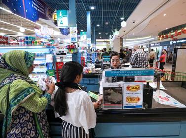Abu Dhabi, U.A.E., June 14, 2018. Eid Al Fitr shopping at LULU Hypermarket, Mushrif Mall.Shoppers queuing at the cashier counters. Victor Besa / The National Section: National