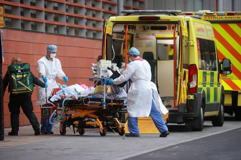 Health care workers transport a patient at the Royal London Hospital, as the spread of the coronavirus disease (COVID-19) continues, in London, Britain, January 19, 2021. REUTERS/Hannah McKay