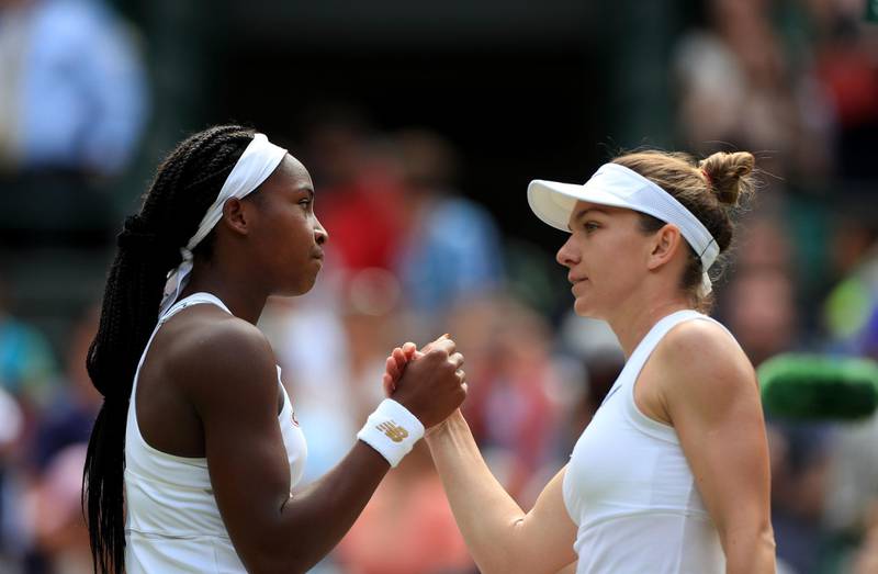 Cori Gauff is dejected following her defeat to Simona Halep (right) on day seven of the Wimbledon Championships at the All England Lawn Tennis and Croquet Club, Wimbledon. PRESS ASSOCIATION Photo. Picture date: Monday July 8, 2019. See PA story TENNIS Wimbledon. Photo credit should read: Mike Egerton/PA Wire. RESTRICTIONS: Editorial use only. No commercial use without prior written consent of the AELTC. Still image use only - no moving images to emulate broadcast. No superimposing or removal of sponsor/ad logos.