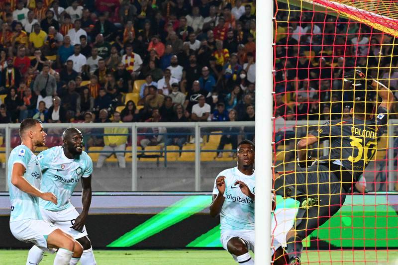 Inter Milan's Dutch midfielder Denzel Dumfries (C) scores the winner. AFP