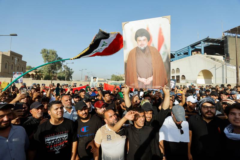 Mr Al Sadr;s supporters gather for a demonstration against corruption in Baghdad. Reuters 