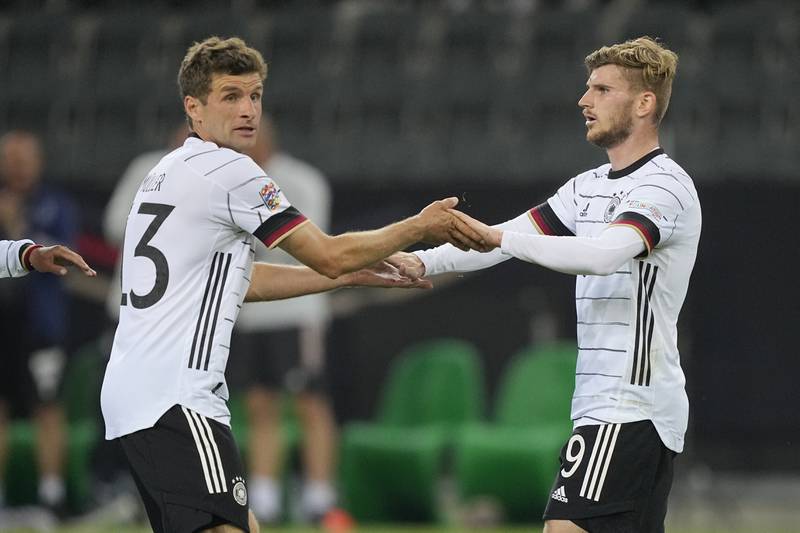 Timo Werner, right, is congratulated by Thomas Muller. AP