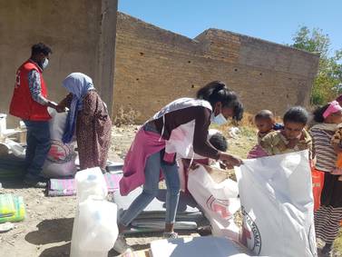 Workers from the International Committee of the Red Cross and volunteers from the Ethiopian Red Cross distribute relief supplies to civilians affected by the fighting in Tigray region. International Committee of the Red Cross via Reuters