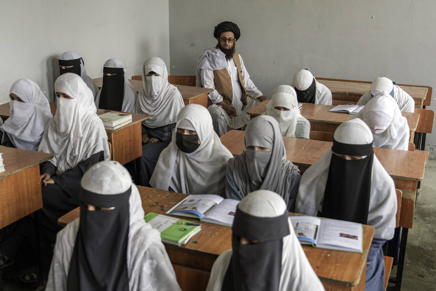 Afghan girls attend a religious school, in Kabul, Afghanistan, in August. Afghan girls have been told they can take high school graduation exams in December even though they have been banned from classrooms. AP