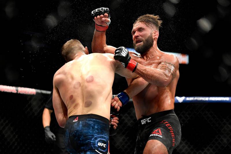 JACKSONVILLE, FLORIDA - MAY 09: Calvin Kattar (L) of the United States knocks down Jeremy Stephens (R) of the United States with an elbow to the face in their Featherweight fight during UFC 249 at VyStar Veterans Memorial Arena on May 09, 2020 in Jacksonville, Florida.   Douglas P. DeFelice/Getty Images/AFP
