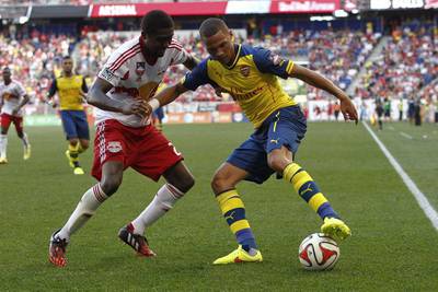 Chris Duvall, left, of New York Red Bulls defends against Kieran Gibbs, right, of Arsenal during their friendly on Saturday. Jeff Zelevansky / Getty Images / AFP